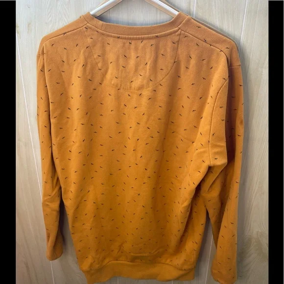 Medium orange sweater with birds. - Picture 2 of 3